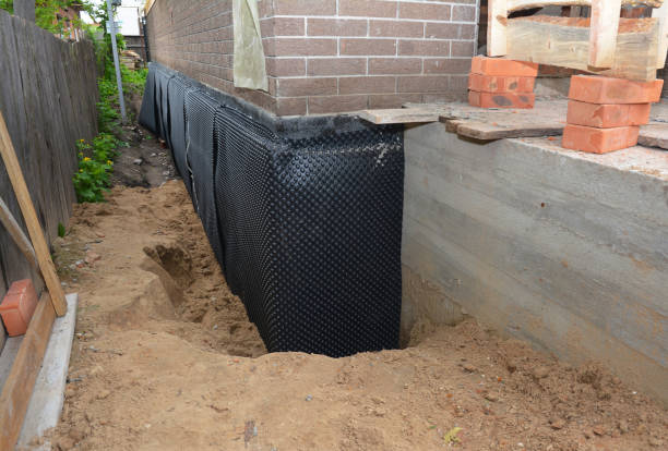 SJ Waterproofing Pros technician performing targeted Waterproofing assessment in Christiansburg, OH